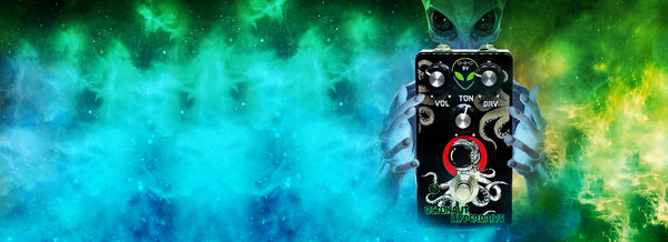 Blue alien holding an Octonaut Hyperdrive OD pedal by Interstellar Audio Machines